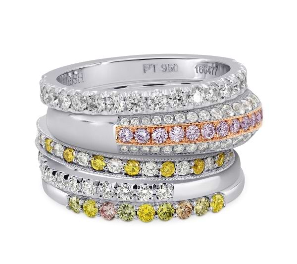 A stack of diamond, pink diamond, and yellow diamond, and multicolor diamond wedding bands